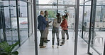 Group of diverse and different aged business people brainstorming on a glass wall in the office with a laptop displaying green screen copyspace in the foreground. Advertise and market your company