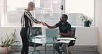 Woman doing an interview with a male HR manager of a design company.  Man and woman sitting at a table discussing a contract in front of a laptop. Female trainee walking into her new workplace