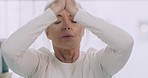 Portrait of one senior caucasian woman meditating in harmony with hands together in namaste gesture while practising yoga. Calm and relaxed lady feeling zen while praying for stress relief and peace