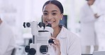 Portrait of a female scientist using a microscope in a laboratory. A healthcare professional analyzing samples for researching a vaccine cure in a scientific health facility, a passion for biology