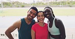 Happy young athletes smiling and laughing while training in a sports stadium outside. Portrait of diverse group of dedicated, confident and motivated runners excited to exercise and workout as a team