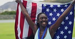 Proud african american athlete celebrating with a flag for becoming a champion. Olympic gold medalist cheering with a medal after winning a race. Woman celebrating a victory while wearing a USA flag