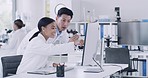 Team of laboratory scientists celebrating with high five gesture after genetic medical research breakthrough in monkeypox cure. Two pathologists, biochemical engineers using a computer and microscope