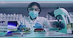 Female scientist modifying and mixing chemicals in a research lab. A chemist creating a cure or treatment for the coronavirus. A healthcare researcher developing a covid vaccine during the pandemic