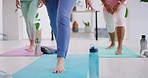 Mature women doing yoga at a fitness center together with copyspace. Females exercising in a fitness class with a yoga instructor, getting into position for better posture, balance and cardio
