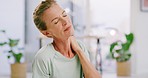 Senior woman with cramp rubbing her neck and shoulder. Face of a stressed, tired and anxious lady unable to concentrate while feeling sore from chronic pain. Worried mature female with stiff muscles