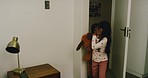 Cute sneaky children waking up their parents in the bedroom. Adorable kids being playful with their mother and father in the morning. Happy daughters surprising their mom and dad  