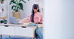 Young student studying at home for an exam or test. Clever and smart high school teen girl reading a book for research while busy with homework and assignments. A good education for a bright future