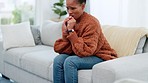 Stressed out young female looking worried and upset while struggling with depression and mental illness. Nervous woman biting her nails and rubbing her hands together while suffering from anxiety