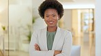 Portrait of lawyer with afro standing with arms crossed in assertive power stance, ready to help new clients. Proud, smiling and confident business woman and manager with her arms folded in law firm