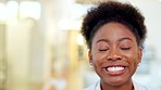 Face of a happy female lawyer smiling and laughing while standing in her attorney office at work. Young advocate or legal counsel feeling confident about an upcoming case or trial for justice