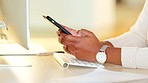 Closeup of a business woman texting on a phone in an office. Hands of a corporate executive and busy entrepreneur typing a message while scrolling online, browsing apps and networking with clients