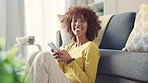 Woman with afro texting on phone, joining dating app and connecting or networking with social media friends in home living room. Portrait of laughing lady playing technology games or browsing online