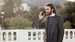 Business man talking on a phone call in the city with copy space. Confident and happy young entrepreneur smiling while communicating good news, networking and making deals with clients outdoors