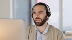 Call center or customer support agent talking to a client using headphones and using hand gestures to explain a product. Male remote worker offering great service and explaining an insurance plan