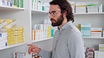 Patient reading pharmacy medication box and searching for over counter remedy to treat illness in local drugstore. Customer seeking medical help, drugs and pills or prescription antibiotics for pain