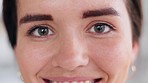 Confident and beautiful female excited to embrace her natural beauty. Portrait of a cheerful young girl happy about her new contact lenses. Closeup of a young woman's face smiling and blinking