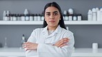Young medical biologist, scientist or chemist proud to be a frontline worker in clinical biology or medicine at an innovative research lab. Face of confident expert female pharmacist with folded arms