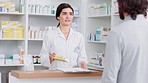 Sick man getting over counter medication at a modern drug store. Consulting with a professional health care worker at pharmacy. Chemist giving advice and support with prescription pills or treatment 