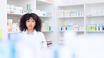 Happy chemist doing stocktake while working in a drugstore and checking medication. Young female pharmacist packing prescription medicine and prescription pills on shelves in the pharmacy