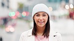 Happy young student laughing and smiling on a city on her way to work downtown. Trendy female intern showing her teeth laughing at a funny joke traveling in town. Positive stylish girl in urban area