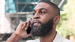 Handsome man talking, chatting and speaking on a phone call. Happy black business man calling a work colleague. African American male employee having a conversation with his corporate manager or boss