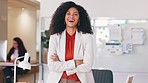 Portrait of a black business woman smiling and laughing while working in an office. Confident HR manager and cheerful african entrepreneur with curly hair feeling motivated and ambitious for success