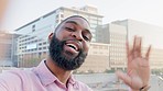 Portrait of male blogger talking and waving hello while showing urban buildings and city view during a vlog. Face of african man having a video call and taking followers on sightseeing trip in a town