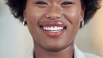 Closeup portrait of female lawyer smiling and laughing while standing in an office at work. The face of one happy, cheerful, and confident black woman working at a legal company as an advocate