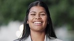 Cheerful businesswoman with a big smile on her face, looking confident with her teeth after having her braces removed. Portrait of a happy, smiling corporate worker standing outdoors