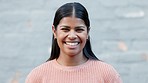 Cheerful woman with a big smile on her face looking confident with her teeth after having her braces removed. Portrait of a young girl smiling with confidence happy with her tooth whitening