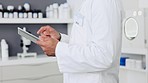 Closeup hands of a scientist doing medical research on a digital tablet. Healthcare professional using app to analyze and check medical test results or assist with online questions from patients