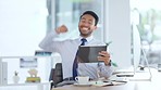 Successful and excited business man cheering with joy while working on digital tablet in an office. Happy trader and banker celebrating victory after reading good news about an exciting deal or bonus