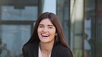 Portrait of a happy and cheerful lawyer standing outside in the city and looking joyful after winning a court case. Face of a smiling advocate laughing before commuting to work in the morning