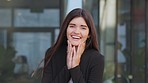 Isolated portrait of a happy white female surprised looking at the camera. Cheerful caucasian young lady laughing, excited to see someone. A beautiful smiling woman standing outside her work office 