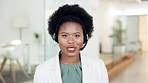 Portrait of interpreter talking, wearing headset and translating foreign language to local speakers in office. Confident and friendly translator with afro hosting online conference call for diplomats