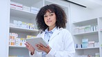 Portrait of a friendly pharmacist checking online precsciptions and orders o digital tablet. Face of a qualified chemist woman using pharma app to update stock system and inventory in a pharmacy