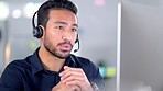 Call center agent talking on headset while working in an office. Confident and happy salesman explaining and selling products while operating a helpdesk for customer sales and service support
