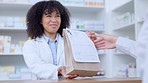 Friendly pharmacists giving prescribed medicine to a customer at a pharmacy. A woman healthcare professional handing a patient their medication at a dispensary. Medical doctor passing a client pills