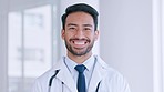 Confident doctor looking happy and positive at hospital. Portrait of a young health care professional ready to assist, consult and diagnose sick patients. Physician excited to treat and cure illness