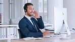Confident male call centre agent talking on headset and looking relaxed while working in an office. Successful and funny salesman consulting and operating a helpdesk for customer service and support
