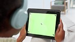 Green screen on a digital tablet and woman wearing headphones to talk on video chat, webinar or conference seminar from home. Closeup of vlogger hosting tutorial and sharing information on technology