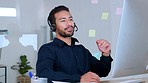 Male call centre agent talking on headset and having pleasant conversation and looking relaxed at office. Confident salesman consulting and operating helpdesk for customer sales and service support
