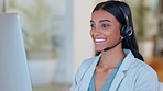 Woman sales consultant talking with a headset microphone at a call center. Happy ecommerce support agent with business communication skills discussing company services or online queries to clients