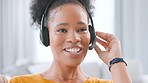 Happy female call center agent talking on headset while working from home. Confident and friendly saleswoman and entrepreneur explaining offers and assisting with customer sales and service support