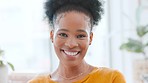 Beautiful woman smiling and laughing looking forward. Portrait of a young female face enjoying her day. Closeup of an African American lady with clear skin, healthy teeth, and good dental hygiene.