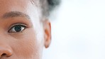Closeup eye of african woman staring at the camera with copyspace for your text. Victim of gender based violence staying woke and aware. Closeup face of black woman with clear skin and makeup
