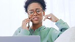Woman talking on a phone while working remotely on a laptop at home. Freelancer answering a call to chat and network with clients and friends. One young female consulting while planning online