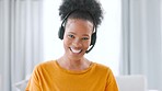 Happy, smiling and confident call center agent with a headset working remotely at home. Portrait of a friendly, helpful and cheerful freelance consultant helping customers with service and support