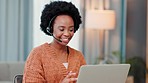 Freelancer, remote worker and call center agent typing on laptop and smiling while wearing headset. Female entrepreneur answering calls and assisting with customer service while working from home